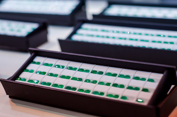 Faceted emerald gemstone for sale in the jewelry store.