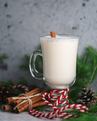 Christmas drink eggnog in a glass on the holiday table