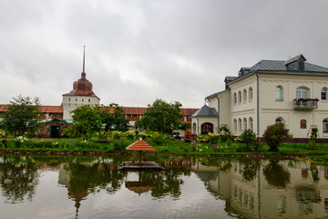 Garden pond with swans and ducks in Tolga convent in Yaroslavl, Russia