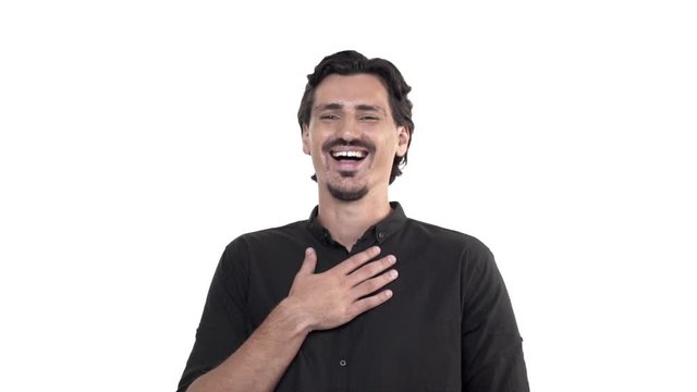 Cheerful good-looking italian guy in black shirt, adult man start laughing out loud, touch chest giggle and bend back from chuckle, hear hilarious joke, having funny conversation, white background
