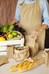 Organic vegetables and fruit in market. man seller with and products in organic food store.  Healthy nutrition, eating, Zero Waste, Lifestyle Concept. Banner for for web, design. 
