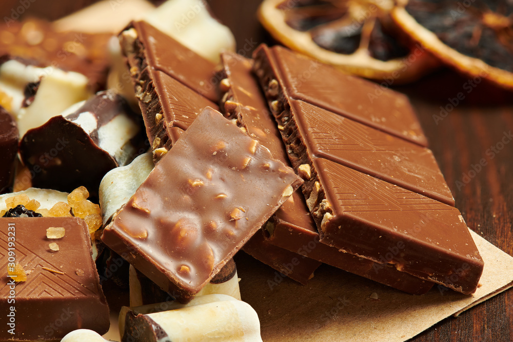 Wall mural chocolate bars and homemade candies on rustic table, sweet food, macro photo