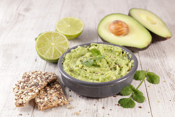 homemade guacamole with cracked bread