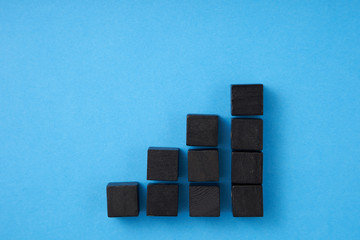 graph form by black color wooden block growth