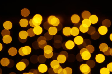 abstract background - photo of yellow bokeh on a black