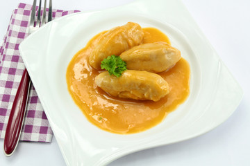 pike dumplings with nantua sauce on a plate