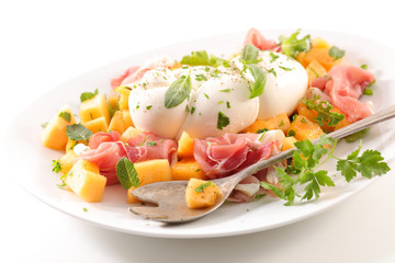 mozzarella with melon, prosciutto ham and basil