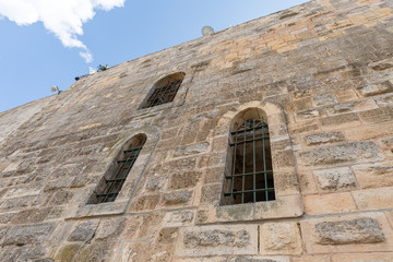 The outer wall of the grave of the prophet Samuel rises above the remnant wall of the crusader fortress of Mount of Joy near Jerusalem in Israel