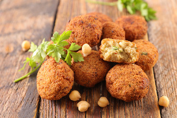 fried falafel with herb on wood background