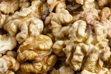 Background texture of walnut kernels. Nut butterflies.