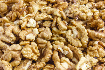 Background texture of walnut kernels. Nut butterflies.