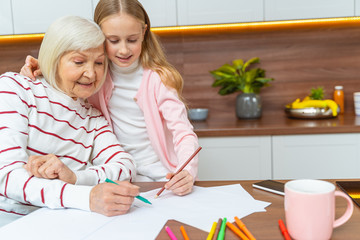 Woman with a felt pen sitting at the table