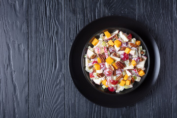 modern apple salad with pecan nuts, flatlay