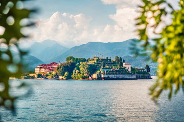 View from Stresa town park of Bella island among the branches of trees. Amazing summer view of...