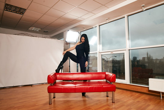 Attractive girl with a good figure dancing strip-plastic in the dance class. Strip-dance. Frame up strip. Sport.