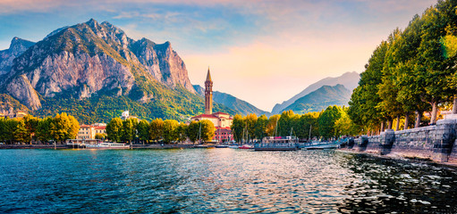 Beautiful morning cityscape of central park of Lecco town, Italy, Europe. Colorful summer sunrise on Como lake. Traveling concept background.