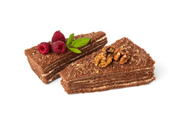 Slice of chocolate cake with raspberry and walnut isolated on white background.