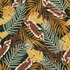 Original seamless tropical pattern with bright yellow and Burgundy plants and leaves on a green background. Beautiful seamless vector floral pattern. Jungle leaf seamless vector floral pattern.