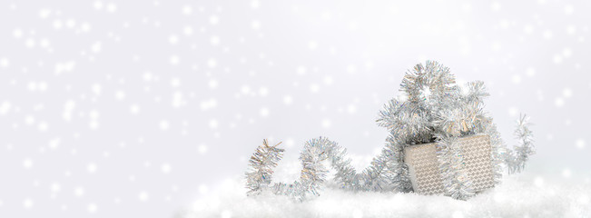 Fototapeta na wymiar Festive Christmas banner. Silver gift box decorated with shiny tinsel in snow on light gray background with snow. 
