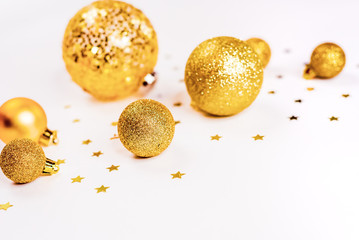 Gold Christmas balls top view, on a white background, ornament, flat lay