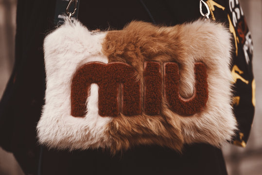 October 2, 2018: Paris, France - Girl wearing a stylish Miu Miu hand bag after a fashion show during Paris Fashion Week  - PFWSS19
