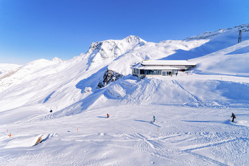 Fototapeta na wymiar Men Skiers and snowboarders Cable car station on Hintertux Glacier