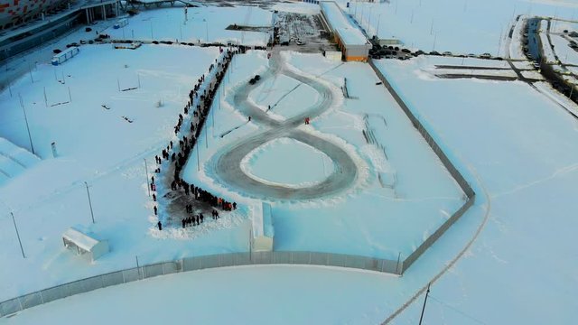 Aerial shot of winter drift competition on Russian Classics Lada VAZ-2107. Taken by drone