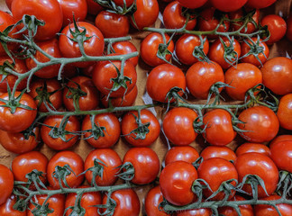 Beautiful red organic cherry tomatoes on a supermarket shelf
