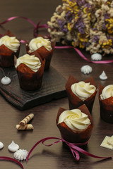 Homemade cupcakes with cream on a dark background, Concept for Valentine's Day, Birthday and Father's day