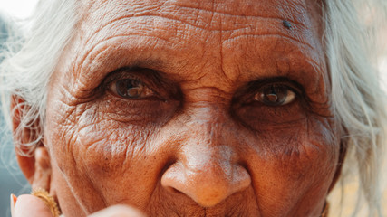 Closeup shot of the eyes of an old woman staring at the camera