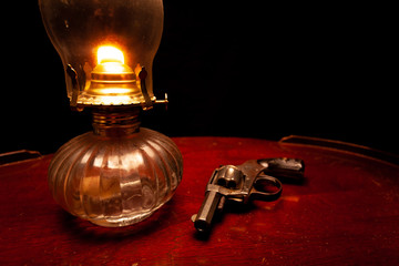 Antique Oil Lamp and Revolver