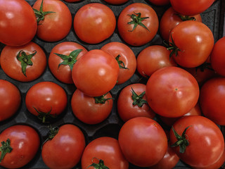 Beautiful red organic cherry tomatoes on a supermarket shelf