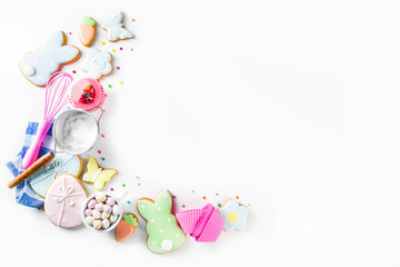 Sweet Easter baking cooking background with traditional Easter bunny and egg cookies, sugar...