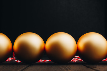 Colored christmas decorations on black wooden table. Xmas balls on wooden background. Top view, copy space. new year.