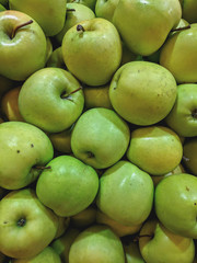  Juicy Organic Apples on a counter in a store.