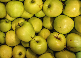  Juicy Organic Apples on a counter in a store.