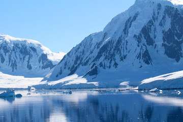 Mountains and icebergs between the islands around the Antarctic Peninsula, Palmer Archipelago, Antarctica