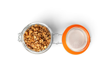  Granola in glass jar isolated on white background.