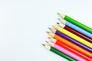 Color pencils on blue background.