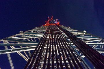Mobile phone Telecommunication Radio antenna Tower. On the tower, work is underway to replace the...