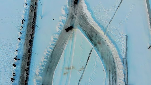 Aerial shot of winter drift competition on Russian Classics Lada VAZ-2107. Taken by drone