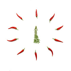 Abstract Christmas background in the form of a clock and a fir tree made of rosemary and chili pepper on a white background. Food concept, Christmas minimalism