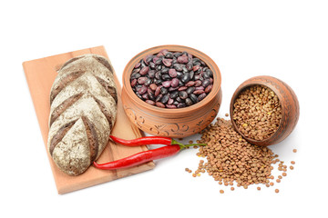Grain bread , kidney bean, uncooked lentils isolated on white background.
