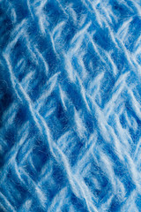 Wool yarn close-up colorful blue threads for needlework.