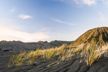 (Selective focus) Stunning view of the Mount Batok and the Mount Bromo illuminated during a...