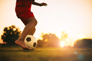 Silhouette action sport outdoors of diversity of kids having fun playing soccer football for...