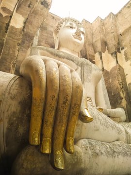 The face of an ancient Buddha image in Sukhothai, Thailand.