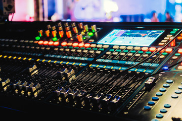 Closeup of an audio mixing control panel - obrazy, fototapety, plakaty