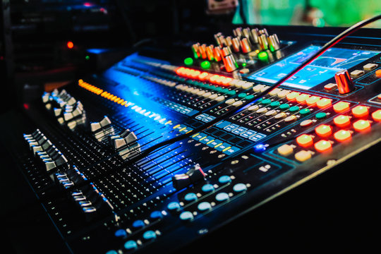 Closeup of an audio mixing control panel