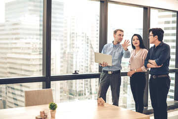 House sales representatives are taking customers to see and offer houses that are selling.